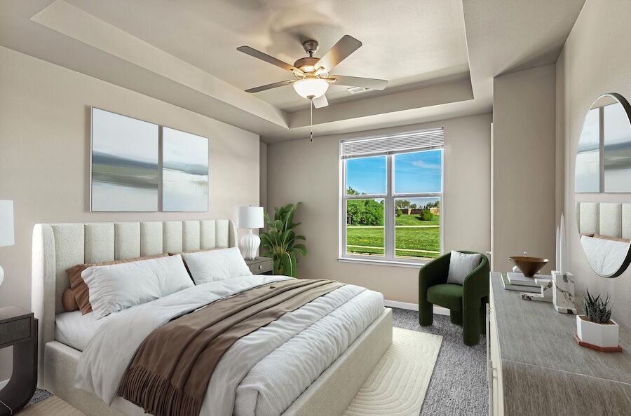 Bedroom with tray ceiling, ceiling fan and window